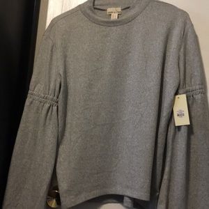 Woman’s gray Sweater